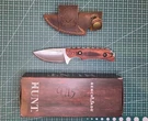 Benchmade Hunting Knife 3.5IN Stainless Steel Straight Edge Wood Handle Sheath. Fixed Price $64.99.